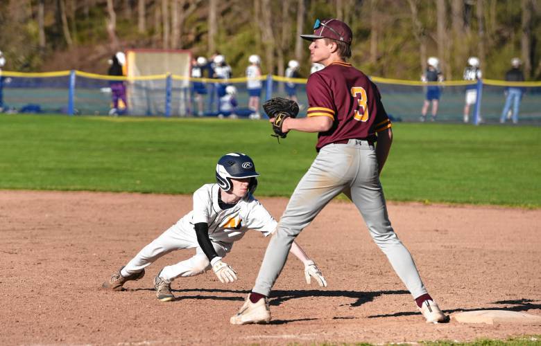 Northampton’s Aiden Zera (10) dives back into first base during the Blue Devils’ game against Chicopee on Monday in Northampton.