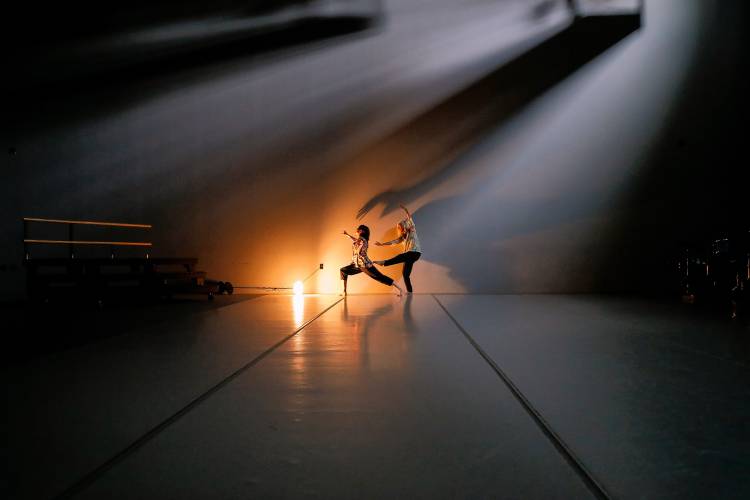 Dancers Maya LaLiberté, left, and Andrea Olsen rehearse in the Workroom Theater at 33 Hawley for their coming performance at the Build-a-Floor Celebration Festival.