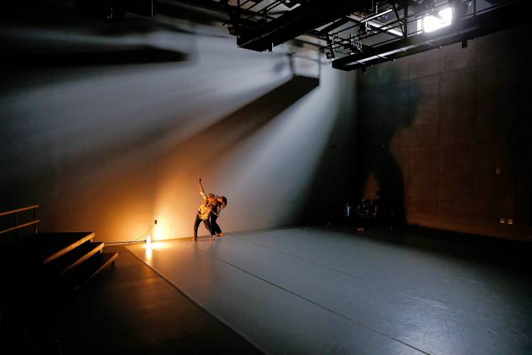 Dancers Andrea Olsen, left, and Maya LaLiberté rehearse in the Workroom Theater at 33 Hawley.