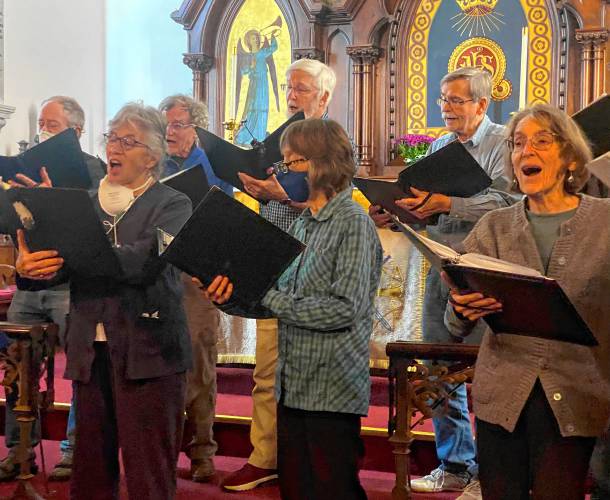 Da Camera Singers rehearsing at St. Andrew and St. James Episcopal Church in Greenfield. The group will perform a 50th anniversary concert, May 11 and 12. 