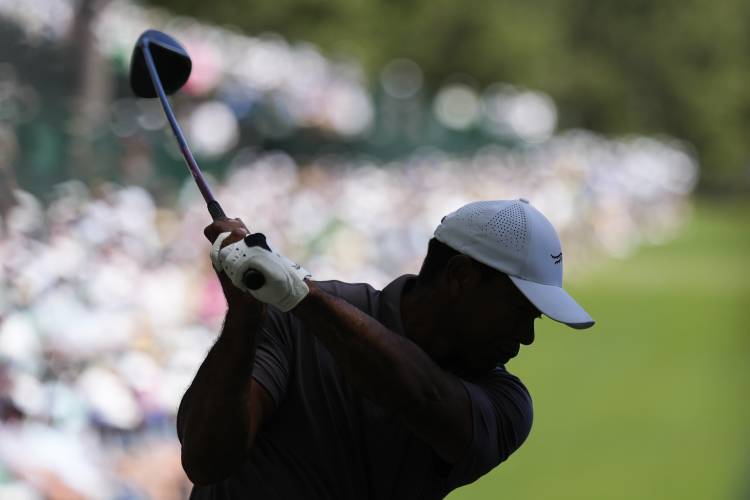 Tiger Woods hits his tee shot on the 14th hole during second round at the Masters golf tournament at Augusta National Golf Club Friday, April 12, 2024, in Augusta, Ga. (AP Photo/David J. Phillip)