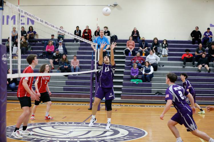 Holyoke’s Michael Melendez (16) sets the ball against Athol in the first set Friday in Holyoke.