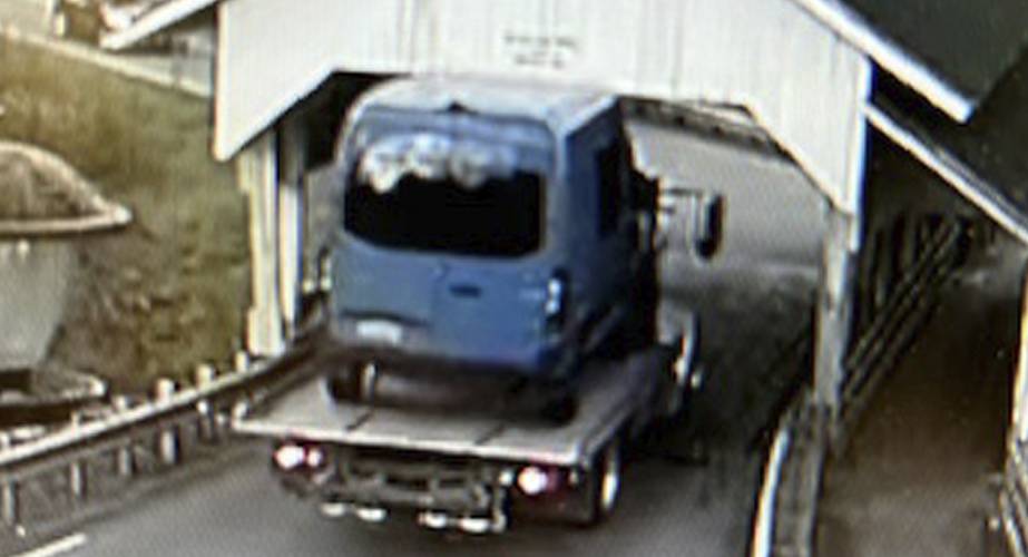 This selection of undated still frames from security video camera footage provided by Michael Grant shows a variety of oversized box trucks crashing through the historic Miller’s Run covered bridge in Lyndon, Vt. Over the years, truck drivers have failed to notice the height warning signs leading to the bridge.