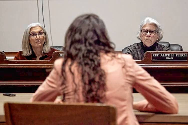 State Sen. Cindy Friedman, left, and Rep. Alice Peisch, right, who lead a legislative committee tasked with reviewing proposed ballot questions, listen to Auditor Diana DiZoglio at a Tuesday hearing about a proposal to give the auditor’s office explicit authority to audit the Legislature.