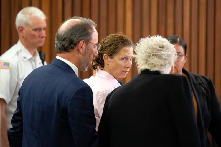 Cara Rintala, with attorneys Chauncey Wood and Rosemary Scapicchio, during her sentencing hearing Thursday at Hampshire Superior Court in Northampton.
