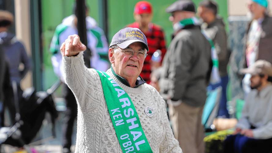  Ken O’Brien, the grand marshal for the Northampton contingent of the Holyoke St. Patrick’s Day parade, waves to the crowd. 