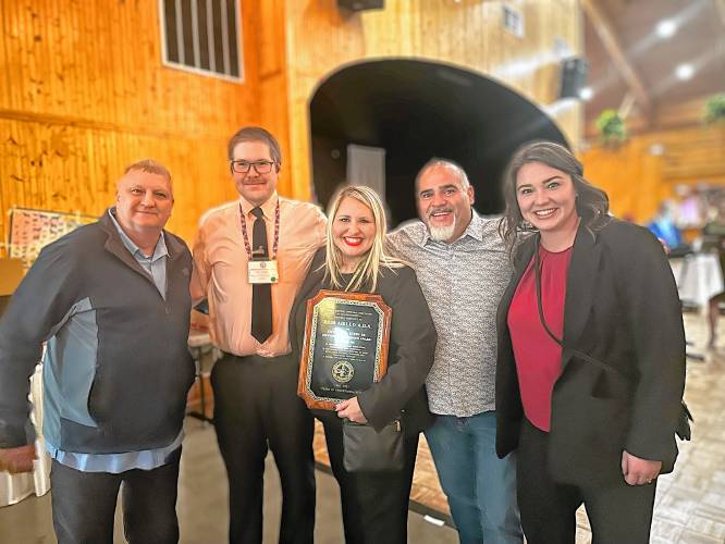 Northwestern Assistant District Attorney Erin Aiello, center, holds her plaque after the award ceremony with, from left,  Lt. Alan Borgal, Animal Rescue League of Boston investigator; Kyle Dragon, Franklin County Sheriff’s Office regional animal control officer; Emanuel Maciel, New Bedford animal control director; and Alyssa Devlin, Northwestern DA’s office paralegal.