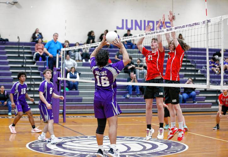 Holyoke’s Michael Melendez (16) sets the ball against Athol in the second set Friday in Holyoke.