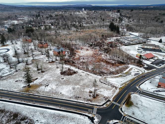 The proposed site of a 108-unit residential development at the old Belchertown State School on Thursday afternoon at the intersection of Carriage Road to the left and Front Street looking north toward the Town Common.