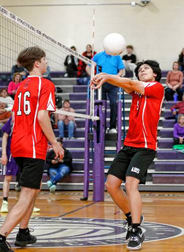 Athol’s Landon Collins (6), right, passes against Holyoke in the second set Friday in Holyoke.