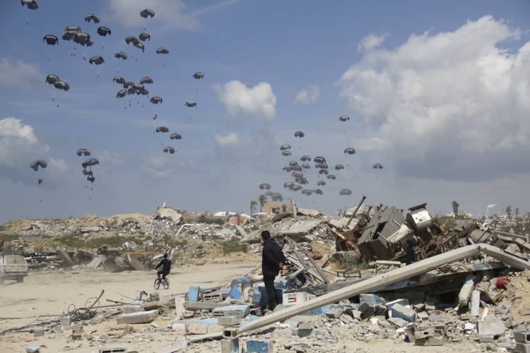 Humanitarian aid is airdropped to Palestinians over Gaza City, Gaza Strip, last Monday.