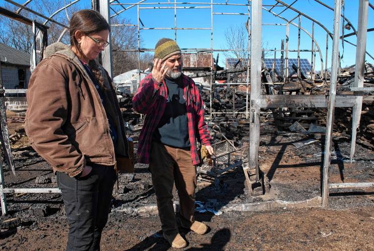 Sarah and Ryan Voiland, owners of Red Fire Farm in Granby, on Feb. 20, 2024, talk about the damage from the fire at their farm and what it will take to rebuild.