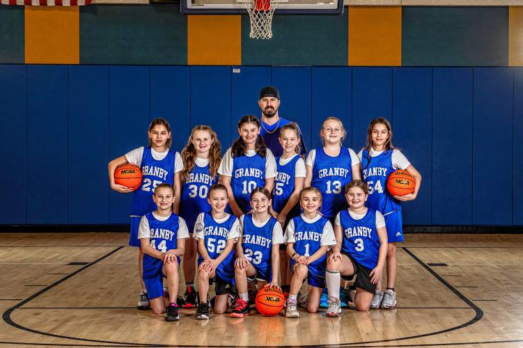 The Granby girls’ third and fourth grade basketball team went undefeated this winter. Pictured are (back row) Coach Mark, (standing) Zoey Hauschild, Aubree Parent, Fiona Marsh, Esmee Siudak, Julia Watracz, Greenly Hauschild, (front row) Grace Durham, Grace Cloutier, Aubrey Vincelette, Gisele Huard and Olivia Moretz.