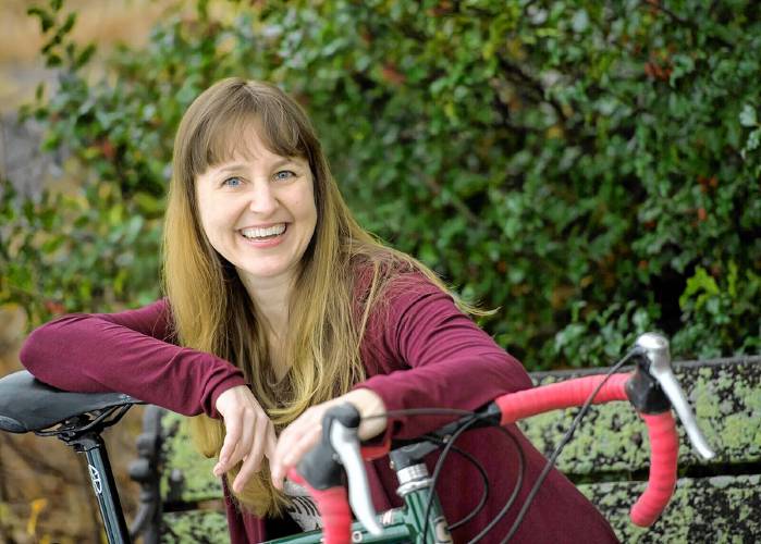 Author and cycling enthusiast Christina Uss comes to the Easthampton Public Library on May 8 to talk books, bicycling, and fixing a flat tire.