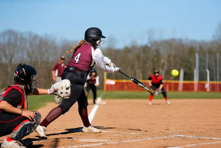 Easthampton’s Makenna Slate (4) drives in two runs with an RBI triple against Hampshire Regional in the top of the third inning Friday in Westhampton.