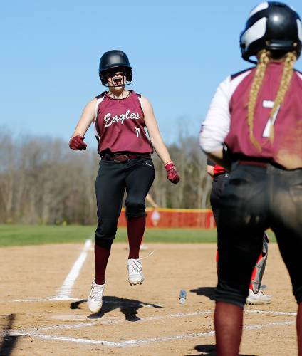 Easthampton’s Kayley Downie (11) celebrates after crossing home plate to score against Hampshire Regional in the top of the third inning Friday in Westhampton.
