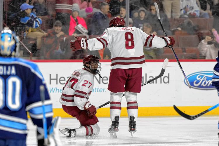 UMass’ Michael Cameron (27), left, and Cam O’Neill (8) celebrate against Maine earlier this season at the Mullins Center.