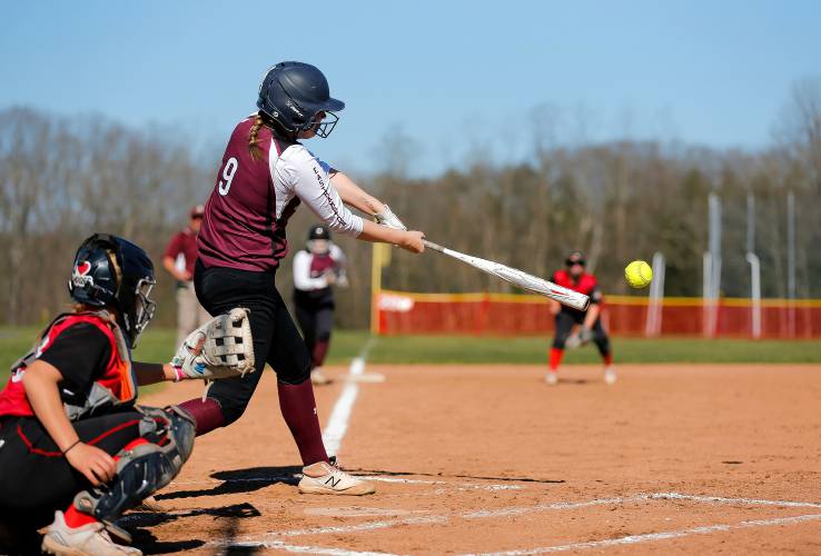 Easthampton’s McKenzie McCarthy (9) drives in a run with a single against Hampshire Regional in the top of the third inning Friday in Westhampton.