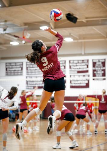 Amherst’s Ruby Austin (9) serves in the fourth set against Holliston during the MIAA Division 3 quarterfinal Thursday in Amherst.