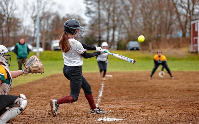Amherst’s Corinne Charlebois (7) hits a sacrifice fly to drive in Sofia Holden (3) from third base in the bottom of the third inning against St. Mary’s on Friday in Amherst.