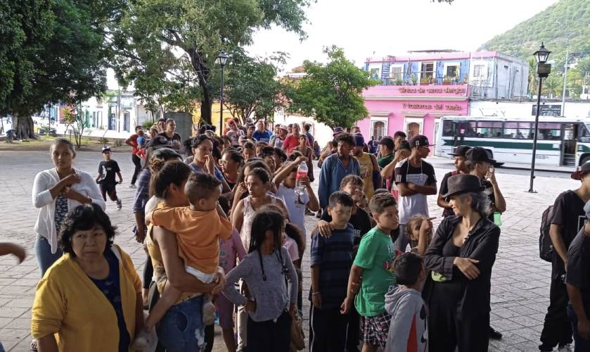 People wait for a meal outside a soup kitchen in the southern Mexican city of Oaxaca, where Jamie and Ginny Elkin of Florence (not pictured) worked for six weeks this spring. The Elkins were so moved by the experience that they are now raising money to send to support the soup kitchen. 