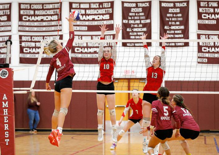 Amherst’s Shannon Klaes (4) attacks at the net in the fourth set against Holliston during the MIAA Division 3 quarterfinal Thursday in Amherst.