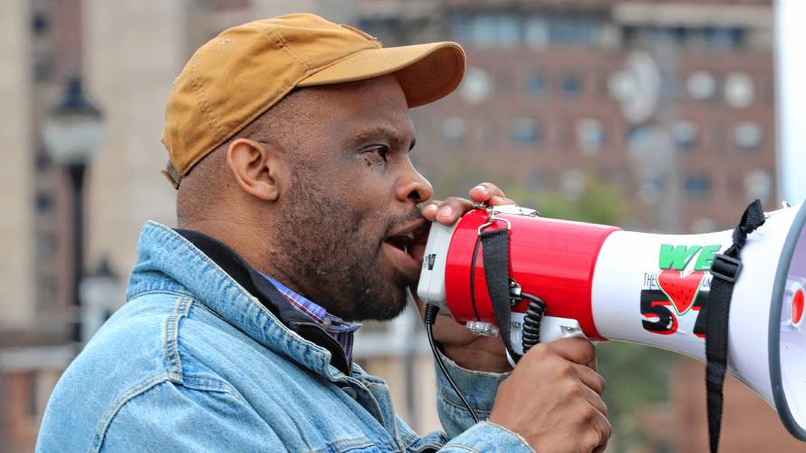 Toussaint Losier, an associate professor of Afro-American Studies at UMass, speaks at a rally on Thursday.