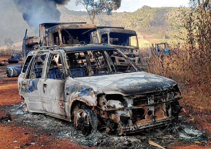 Vehicles smolder in December 2021 in Hpruso township, Kayah state, Myanmar, scene of reported massacre by government troops.