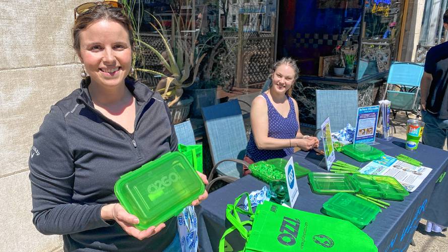 Jess Cantone, left, and Amber Schmidt stand outside Northampton restaurant La Veracruzana on Thursday to promote the Mexican eatery’s new reusable takeout containers. 