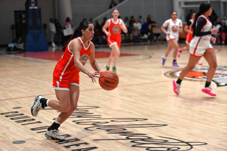 Northampton’s Ava Azzaro pushes the ball up the right sideline during the Naismith Memorial Basketball Hall of Fame Western Mass. Girls Senior All-Star Game on Thursday night in Springfield.