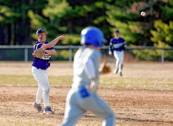 Smith Academy second baseman Harry LaFlamme (23) throws to first for an out against Granby in the bottom of the second inning Friday in Granby.