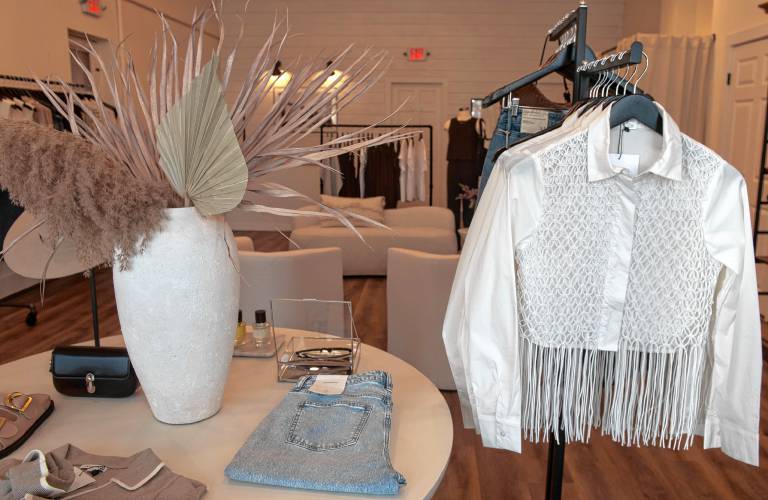Clothes at the new shop opened by Kayla Diggins in Easthampton called  Harper James, which offers a range of moderately priced women’s clothing — skirts and dresses, sweaters, blazers, tops and jeans — in neutral and cool tones.
