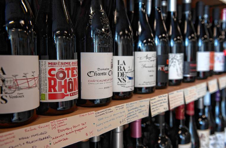 Wines and their handwritten descriptions at Tip Top Wine Shop, owned by  Lauren Clark and Miranda Brown,  in Easthampton. 