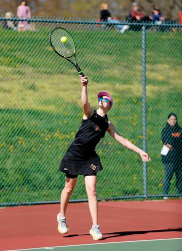 Belchertown’s Zoe Bate serves against South Hadley’s Maddie Soderbaum during their No. 3 singles match Thursday at Mount Holyoke College.