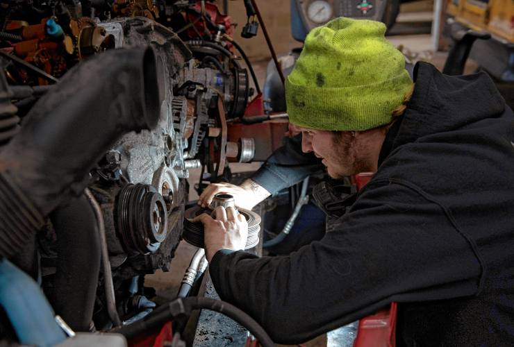 Brandon Seal, an employee of Harrison Diesel Solutions, works on an engine at the business at 4 Linseed Road in Hatfield. The heavy equipment maintenance business is owned by husband and wife Drew and Ashley Harrison, who last fall bought out G&S Industrial, where Drew had once worked as a foreman. 