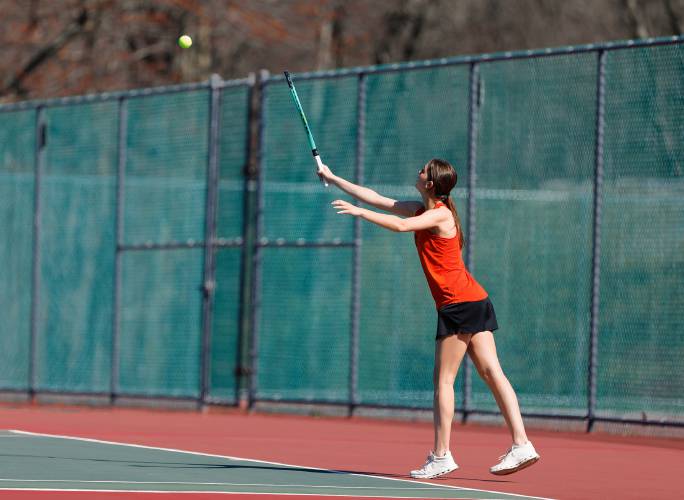 South Hadley’s Maddie Soderbaum serves against Belchertown’s Zoe Bate during their No. 3 singles match Thursday at Mount Holyoke College.