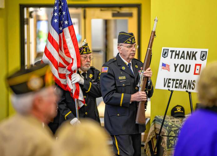 American Legion Post 260 members Walter Southard, left, and Keith Buckhout lead an honor guard during South Hadley’s National Vietnam War Veterans Day Commemoration at the South Hadley Public Library on Thursday.