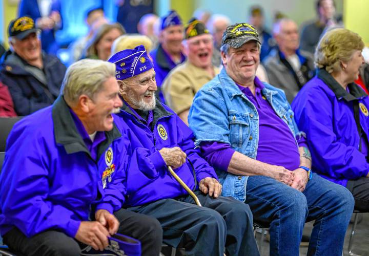 Vietnam veterans share a laugh during South Hadley’s National Vietnam War VeteransDay Commemoration at the South Hadley Public Library on Thursday.