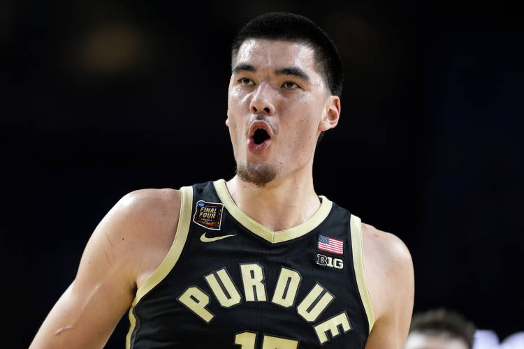 Purdue center Zach Edey celebraters after a basket against UConn during the first half of the NCAA college Final Four championship basketball game, Monday, April 8, 2024, in Glendale, Ariz. (AP Photo/Brynn Anderson)