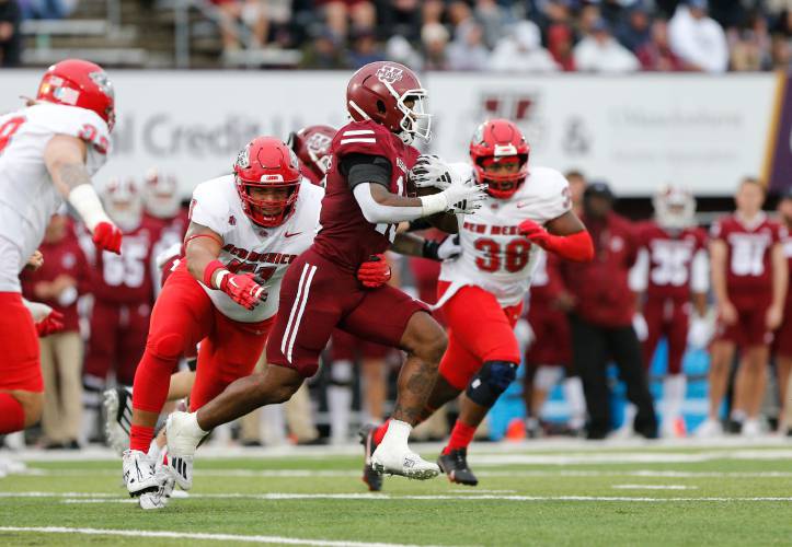 UMass running back Kay’Ron Lynch-Adams (15) rushes against New Mexico in the second quarter of a game last season at McGuirk Alumni Stadium in Amherst.