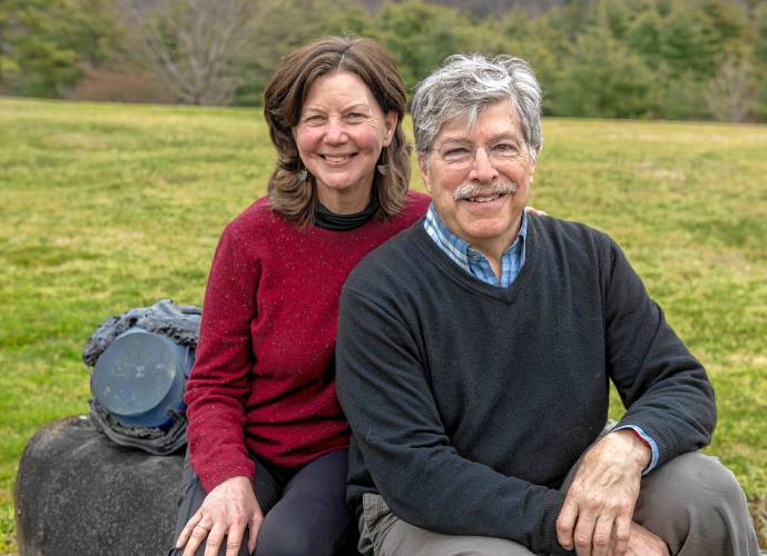 Josh Simpson and his wife, Cady Coleman, sit outside their Shelburne Falls home. Simpson, a finalist for the 2024 Valley Voices Story Slam crown, and 11 other competitors will tell their tales at Northampton’s Academy of Music on April 13.