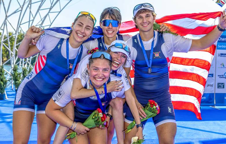 Easthampton’s Saige Harper (front) celebrates with her Team USA teammates during the 2023 World Rowing Championships in Serbia last September. She will compete in the 2024 Paralympic Games in Paris this summer.