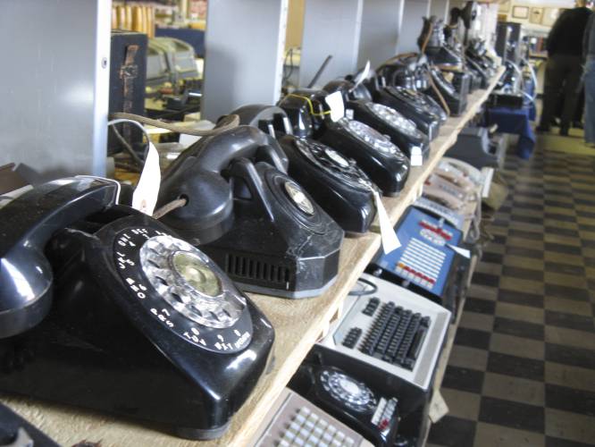 In a Saturday Nov. 12, 2011 photo, rows of old and newer telephones along with office switchboards are in the museum operated by members of the Parkersburg Council of the Telecomm Pioneers in Parkersburg, W.Va. As a Thursday, Feb. 22, 2024, cell phone outage shows, sometimes landline telephones can come in handy, and were suggested as part of the alternatives when people’s cell phones weren’t working.