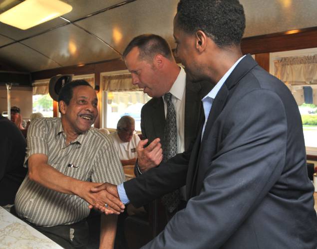 Then-Northampton Mayor David Narkewicz introduces Setti Warren, A Democrat running for governor, to Bill Hairston at the Bluebonnet Diner in July 2017.