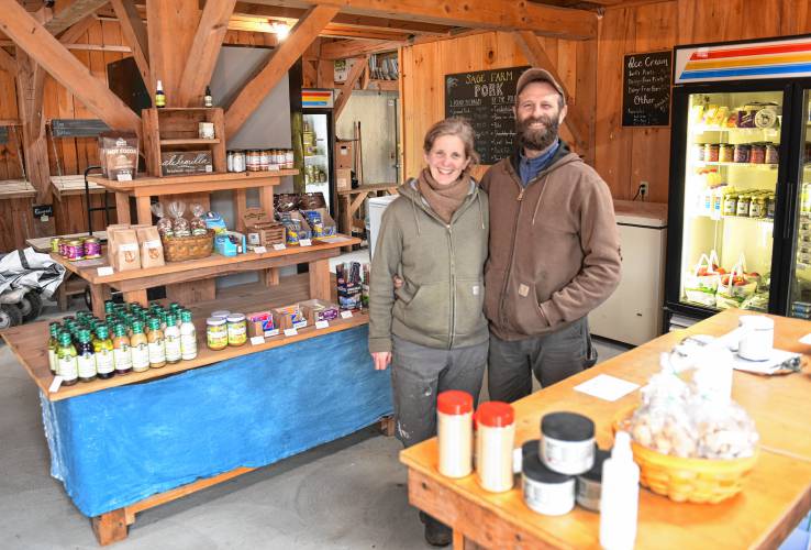 Maggie Toran and David Fisher in their farm store at Natural Roots Farm in Conway.