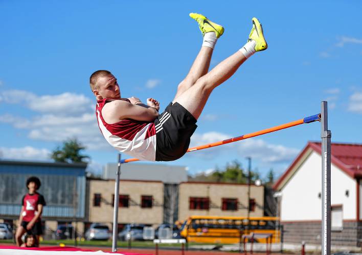 Easthampton’s Guiseppe DeNucce-Simms competes in the high jump for first place Tuesday during their meet against Belchertown at Mountain View School in Easthampton.