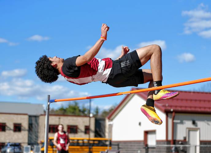 Easthampton’s Nelson Gomez competes in the high jump for second place Tuesday during their meet against Belchertown at Mountain View School in Easthampton.