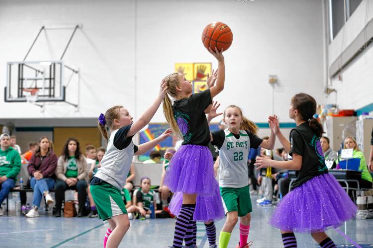 Four Purple Pandas player Faith Stanisewski takes a shot while playing against the St. Pats team during the second annual Magic for Maddie 3v3 Basketball Tournament to benefit the Maddie Schmidt Memorial Scholarship on Saturday at the William E. Norris School in Southampton. Hundreds gathered for the tournament to celebrate the legacy of 8-year-old Maddie Schmidt, who died from a rare brain cancer on New Year’s Eve in 2022.