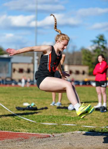 Belchertown’s Fallon Clancy competes in the long jump for first place Tuesday during their meet against Easthampton at Mountain View School in Easthampton.