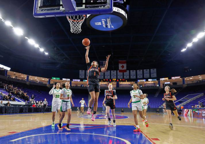 South Hadley’s Drew Alley (1) puts in a breakaway layup against Cathedral in the first quarter of the MIAA Div. 4 girls basketball state final Sunday afternoon at the Tsongas Center in Lowell.